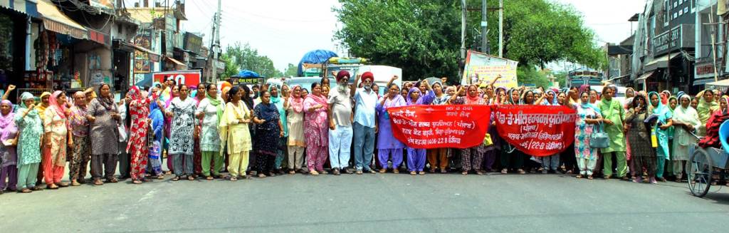 Midday meal workers stage road blockade to protest against stagnant wages